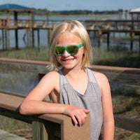 Thumbnail for Little girl wearing green polarized kids sunglasses by sunnies shades.