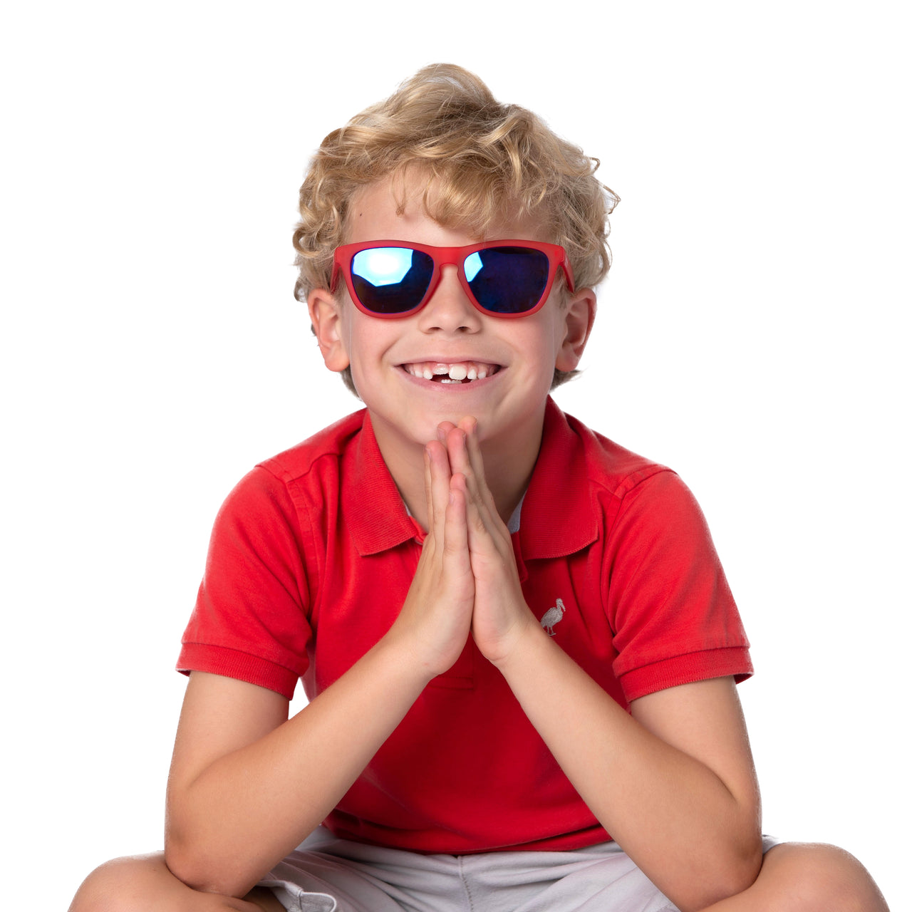 Little boy wearing red polarized kids sunglasses