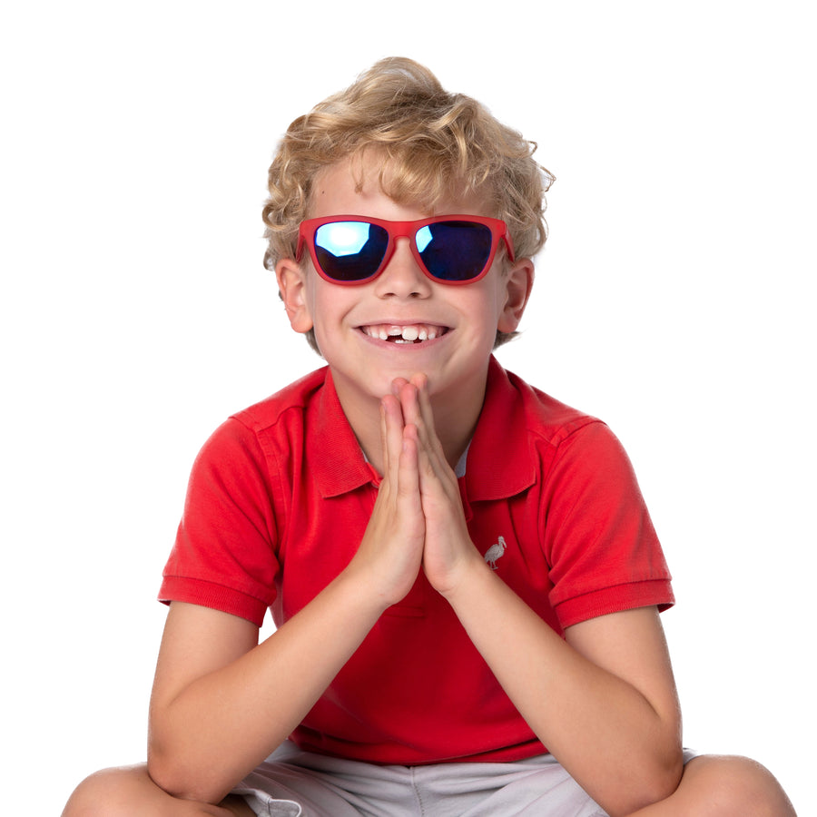 Little boy wearing red polarized kids sunglasses