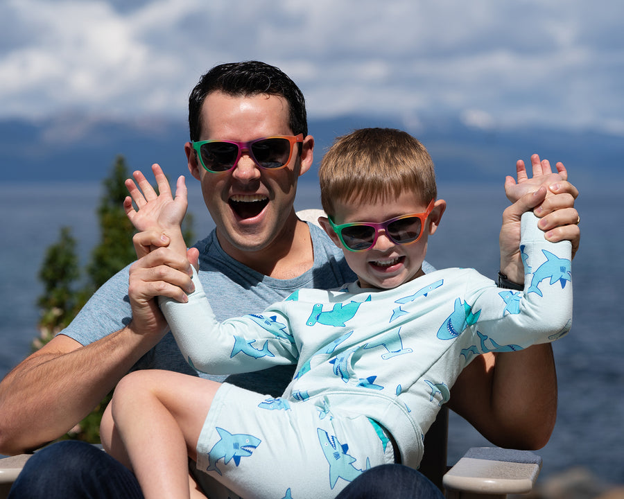 Little boy and man wearing matching polarized sunglasses in a rainbow frame from Sunnies Kiddo and Me Collection