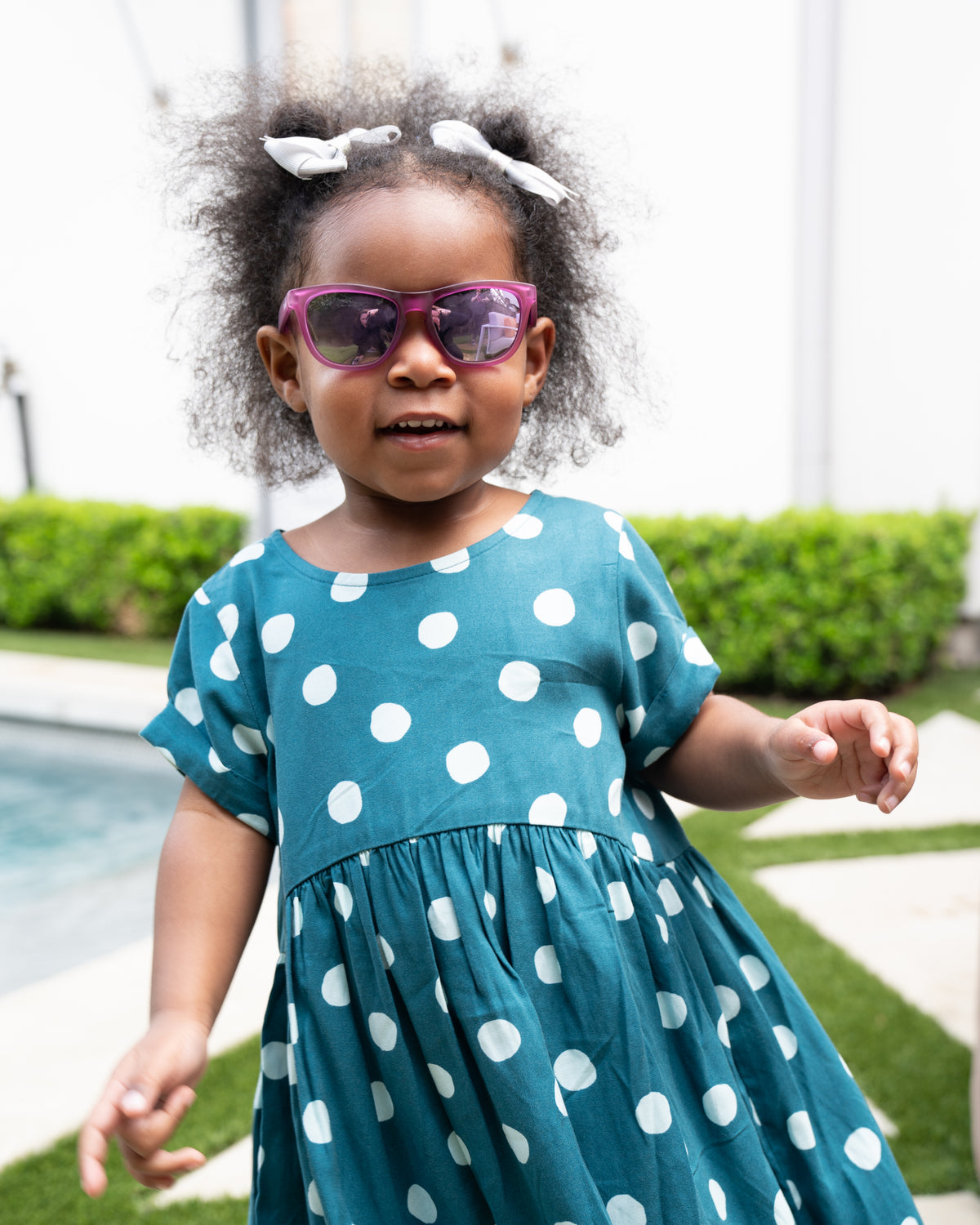 2 year old girl wearing Sunnies Littles sunglasses for kids 1 to 3 years old  in Not My Gumdrop Button