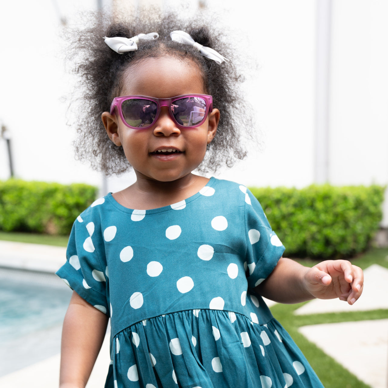 2 year old girl wearing Sunnies Littles sunglasses for kids 1 to 3 years old  in Not My Gumdrop Button