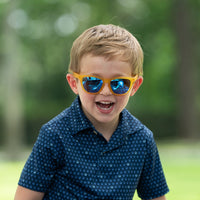 Thumbnail for Cute boy wearing Just Monkeying Around polarized sunnies shades with transparent yellow frame and reflective blue polarized lenses