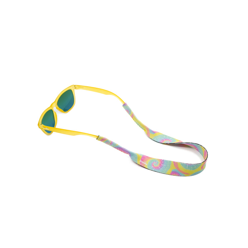 Kids tie dye sunglass strap attached to a pair of yellow sunnies kids sunglasses